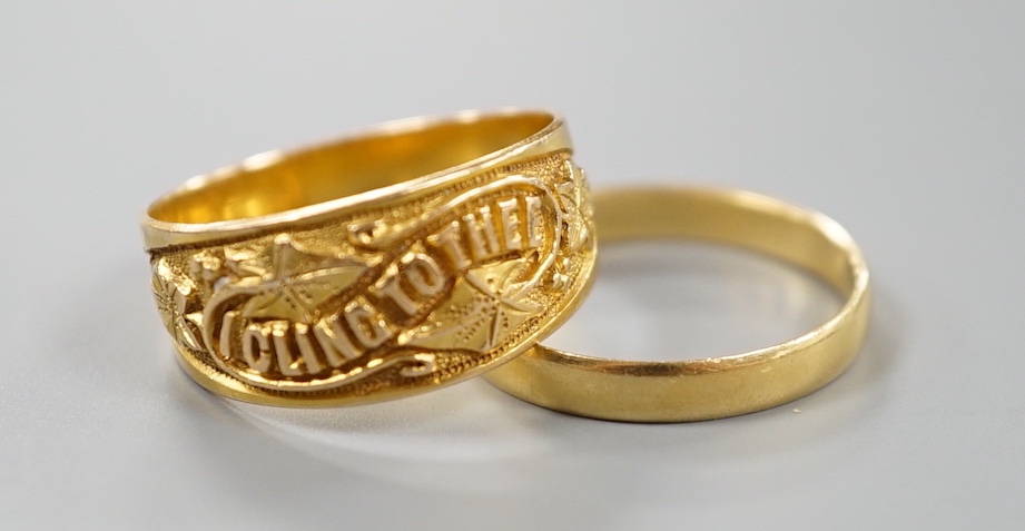 A late Victorian 18ct gold band, embossed with the phrase 'I Cling To Thee', size P/Q and a later 18ct gold wedding band, size P/Q